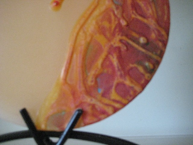 Aromatizovaná svíčka 'vesuv'se stojánkem .Barva:oranžová Průměr:14cm