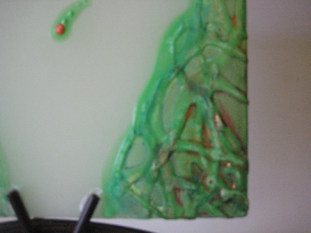 Malovaná aromatizovaná svíčka'vesuv' se stojánkem  Barva:zelená Rozměr:14x14cm